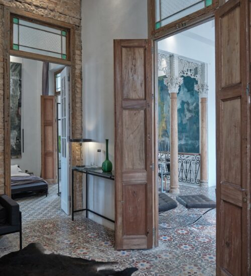 Royal Suite, showing the extraordinary architecture of this historical mansion with its countless wooden doors, luxury pillars and stunning ceiling heights